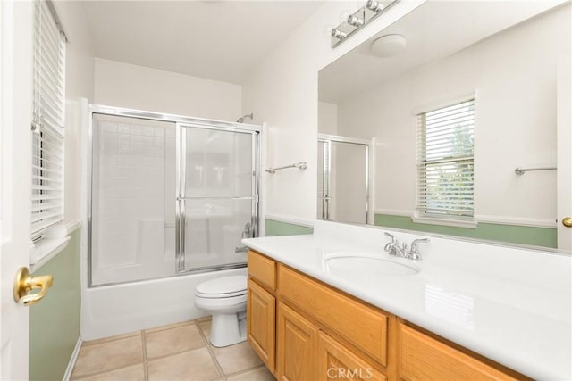 40 Calais, Irvine, CA 92602 - full bath featuring vanity, toilet, tile patterned floors, and bath / shower combo with glass door