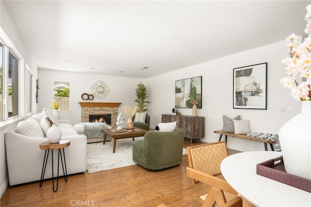 40 Calais, Irvine, CA 92602 - living room with light wood-type flooring and a fireplace