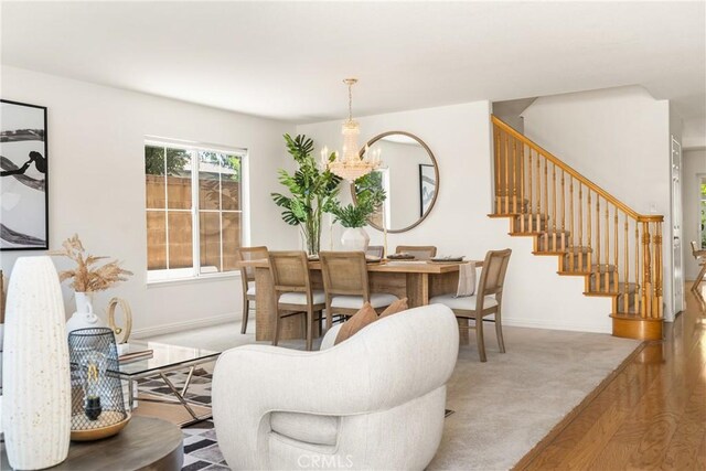 40 Calais, Irvine, CA 92602 - carpeted living room featuring a chandelier, baseboards, and stairs