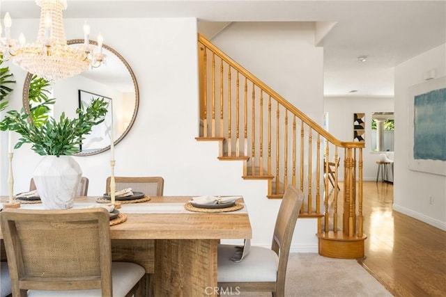 40 Calais, Irvine, CA 92602 - dining area featuring stairway, a chandelier, wood finished floors, and baseboards
