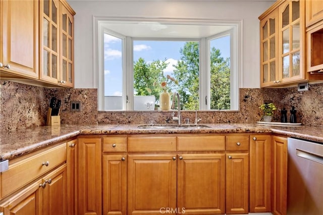 94 E Highland Ave, Sierra Madre, CA 91024 - kitchen featuring stainless steel dishwasher, a sink, light stone countertops, backsplash, and glass insert cabinets