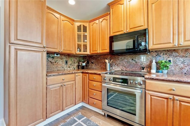 94 E Highland Ave, Sierra Madre, CA 91024 - kitchen with black microwave, stainless steel electric range oven, light stone counters, and backsplash