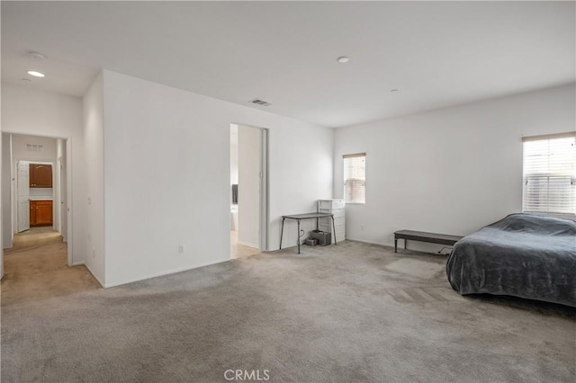 40991 Bankhall St, Lake Elsinore, CA 92532 - carpeted bedroom featuring multiple windows and baseboards