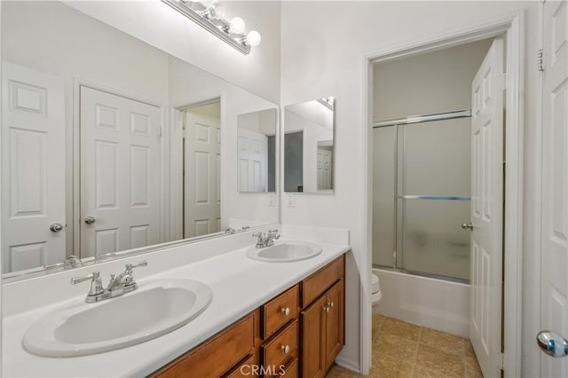 40991 Bankhall St, Lake Elsinore, CA 92532 - bathroom featuring toilet, double vanity, enclosed tub / shower combo, and tile patterned flooring