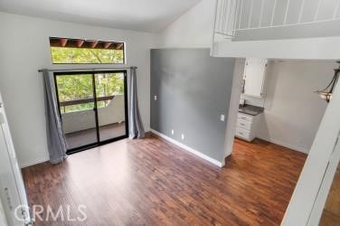 27929 Tyler Ln Unit 744, Canyon Country, CA 91387 - empty room with lofted ceiling and wood finished floors