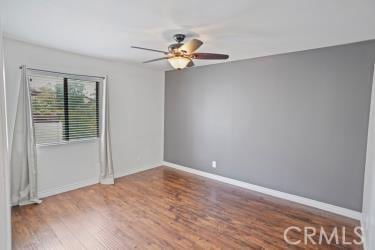 27929 Tyler Ln Unit 744, Canyon Country, CA 91387 - spare room featuring wood finished floors, ceiling fan, and baseboards