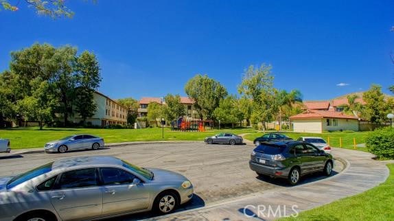27929 Tyler Ln Unit 744, Canyon Country, CA 91387 - uncovered parking lot featuring a residential view