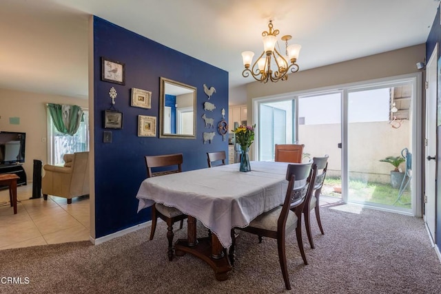 686 Martinique Pl, Newbury Park, CA 91320 - dining area featuring light carpet, a chandelier, baseboards, and light tile patterned floors