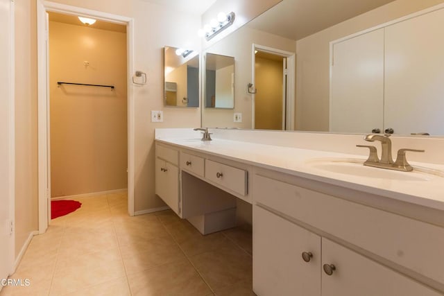 686 Martinique Pl, Newbury Park, CA 91320 - bathroom with tile patterned flooring, double vanity, and baseboards