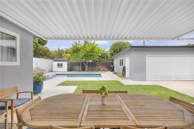 2829 Albury Ave, Long Beach, CA 90815 - view of pool with a patio area, an outbuilding, outdoor dining space, and a storage shed