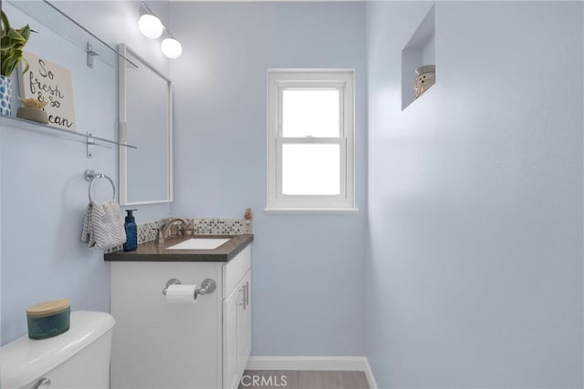 2829 Albury Ave, Long Beach, CA 90815 - bathroom with toilet, vanity, and baseboards
