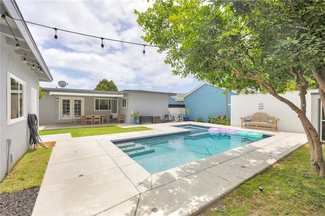 2829 Albury Ave, Long Beach, CA 90815 - view of pool with a patio, french doors, an in-ground hot tub, central air condition unit, and fence