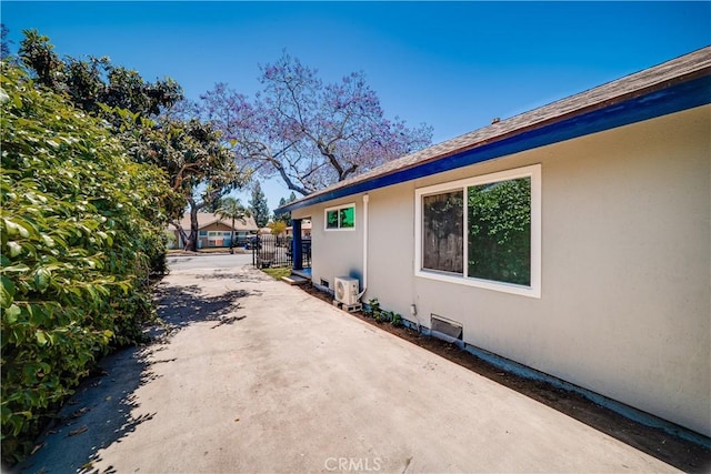 10091011 W Myrtle St, Santa Ana, CA 92703 - view of concrete driveway with a gated entry
