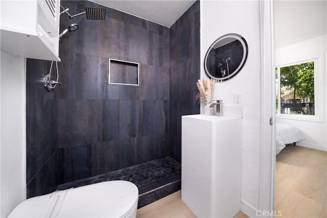 10091011 W Myrtle St, Santa Ana, CA 92703 - full bathroom with a walk in shower, toilet, wood finished floors, and vanity