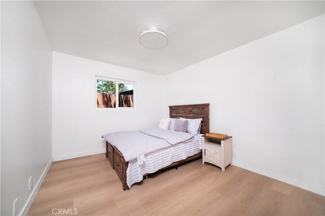 10091011 W Myrtle St, Santa Ana, CA 92703 - bedroom with light wood finished floors and baseboards