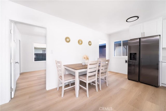 10091011 W Myrtle St, Santa Ana, CA 92703 - dining space with light wood finished floors