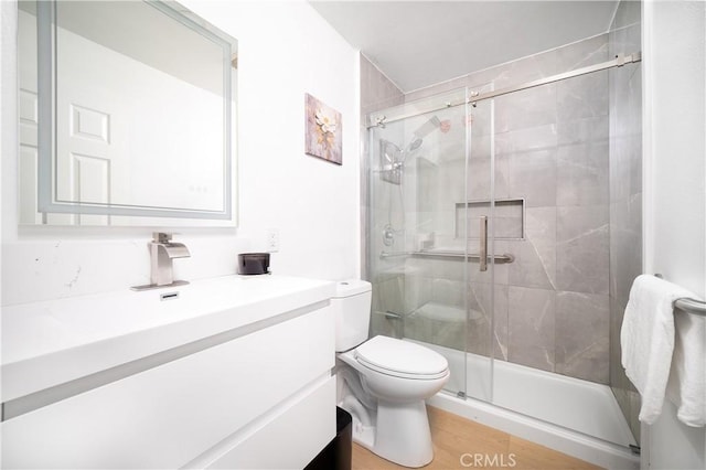 10091011 W Myrtle St, Santa Ana, CA 92703 - full bath with vanity, a shower stall, toilet, and wood finished floors