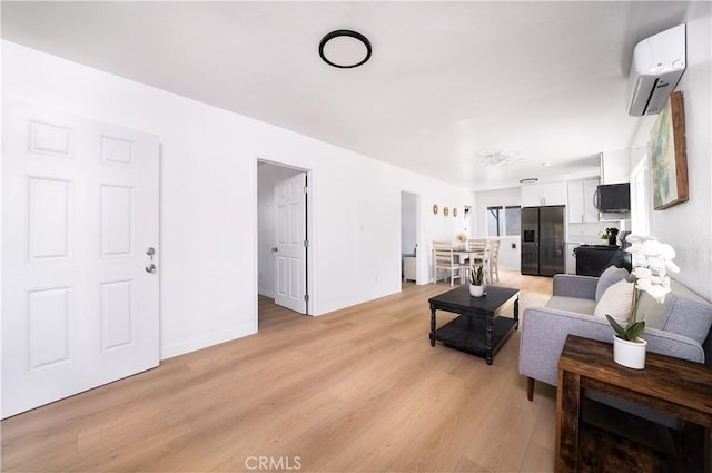10091011 W Myrtle St, Santa Ana, CA 92703 - living room with a wall unit AC, light wood finished floors, and baseboards