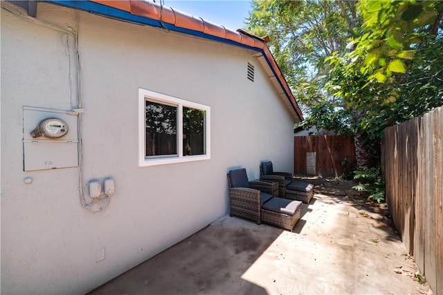 10091011 W Myrtle St, Santa Ana, CA 92703 - view of home's exterior with stucco siding and a patio