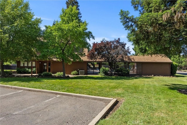 2912 Pennyroyal Dr, Chico, CA 95928 - view of front of property with uncovered parking and central AC