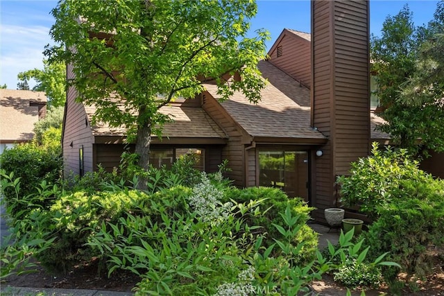 2912 Pennyroyal Dr, Chico, CA 95928 - view of front of property with a chimney and a shingled roof