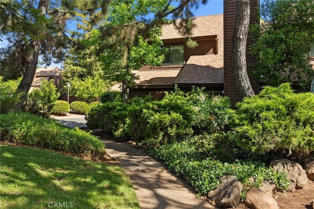 2912 Pennyroyal Dr, Chico, CA 95928 - view of front of house with a chimney and a shingled roof
