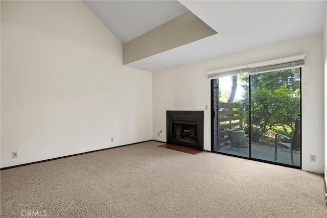 2912 Pennyroyal Dr, Chico, CA 95928 - unfurnished living room with carpet, a fireplace with flush hearth, vaulted ceiling, and baseboards