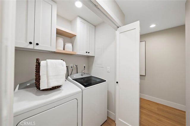 clothes washing area featuring independent washer and dryer, cabinet space, baseboards, light wood-style floors, and recessed lighting