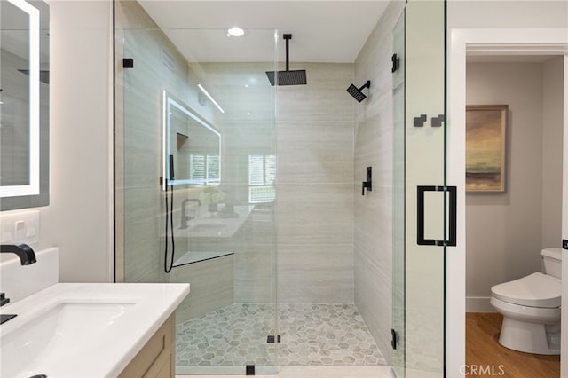 full bath with toilet, a shower stall, vanity, and recessed lighting