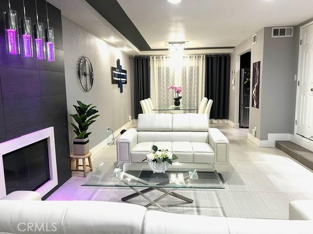 2163 N Justin Ave N, Simi Valley, CA 93065 - living area featuring baseboards and tile patterned floors