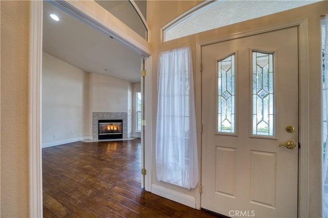 635 Shelter Ridge Pl, Nipomo, CA 93444 - entrance foyer with dark wood-type flooring, a fireplace with flush hearth, and lofted ceiling