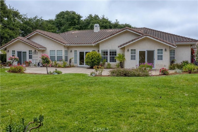 635 Shelter Ridge Pl, Nipomo, CA 93444 - back of house featuring a chimney, a lawn, a tiled roof, and stucco siding