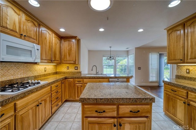 635 Shelter Ridge Pl, Nipomo, CA 93444 - kitchen featuring white appliances, recessed lighting, backsplash, light tile patterned flooring, and a center island