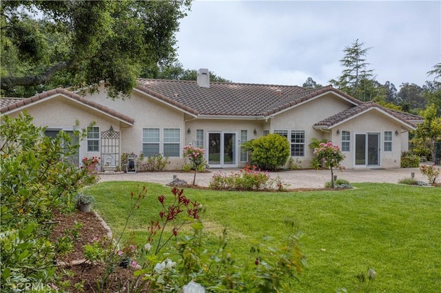 635 Shelter Ridge Pl, Nipomo, CA 93444 - back of house featuring a chimney, stucco siding, a tile roof, and a yard
