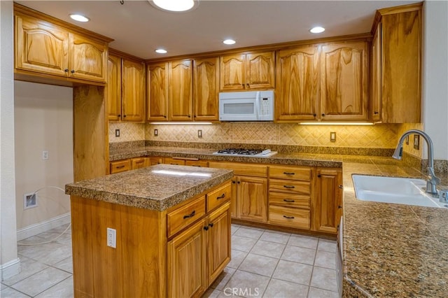 635 Shelter Ridge Pl, Nipomo, CA 93444 - kitchen featuring white appliances, brown cabinetry, light tile patterned floors, backsplash, and recessed lighting