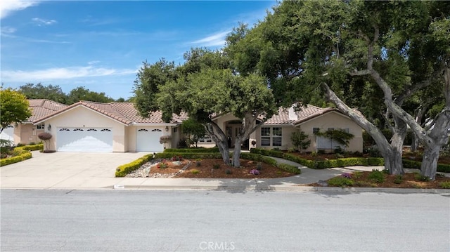 635 Shelter Ridge Pl, Nipomo, CA 93444 - view of front of home featuring an attached garage, driveway, a tile roof, and stucco siding