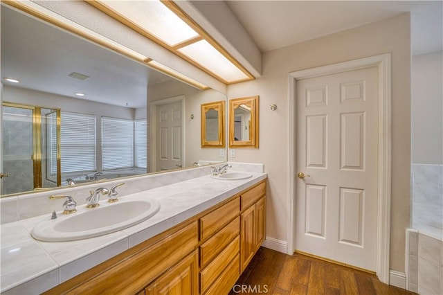 635 Shelter Ridge Pl, Nipomo, CA 93444 - bathroom with double vanity, wood finished floors, and an enclosed shower