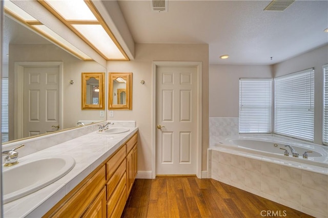 635 Shelter Ridge Pl, Nipomo, CA 93444 - bathroom with a bath, wood finished floors, and double vanity