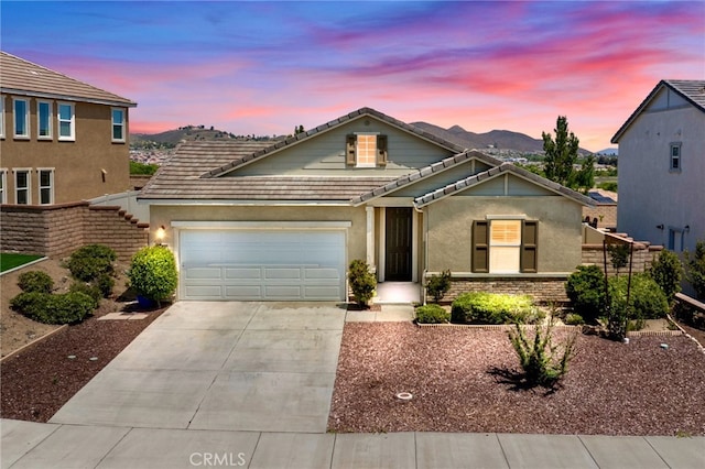 24848 Coldwater Canyon Trl, Menifee, CA 92584 - traditional home with a tiled roof, an attached garage, concrete driveway, and stucco siding