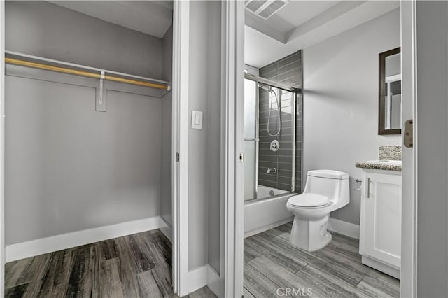 202 E 116th St, Los Angeles, CA 90061 - full bath featuring wood finished floors, vanity, toilet, and baseboards