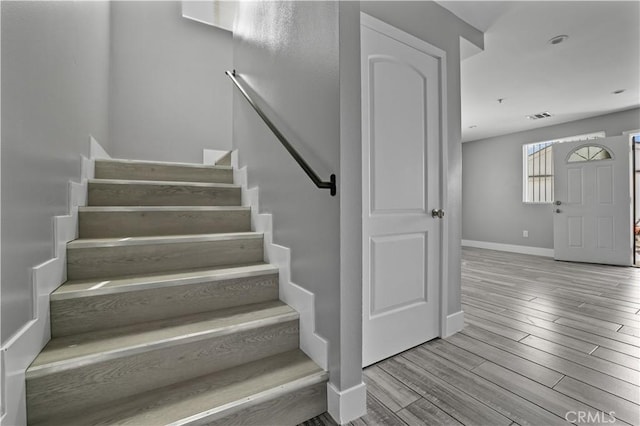 202 E 116th St, Los Angeles, CA 90061 - stairway with baseboards and wood finished floors