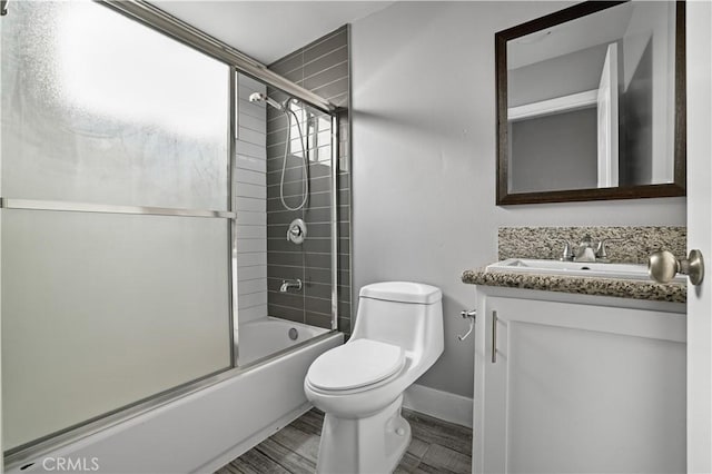 202 E 116th St, Los Angeles, CA 90061 - bathroom with vanity, toilet, combined bath / shower with glass door, and baseboards