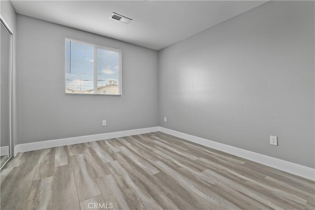 202 E 116th St, Los Angeles, CA 90061 - empty room featuring wood finished floors and baseboards