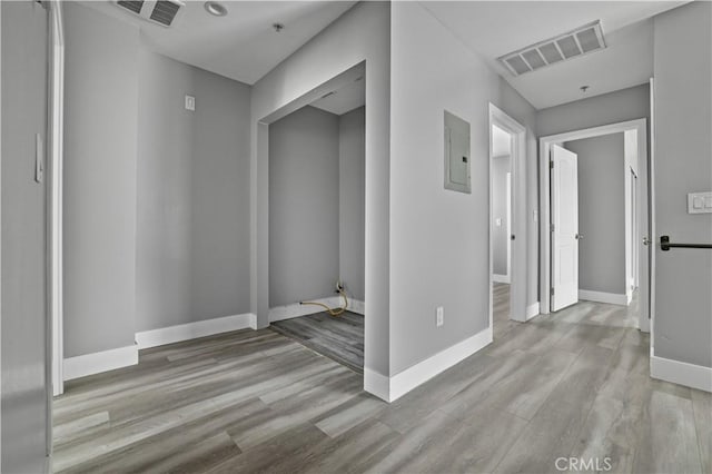 202 E 116th St, Los Angeles, CA 90061 - hallway with wood finished floors, baseboards, and electric panel