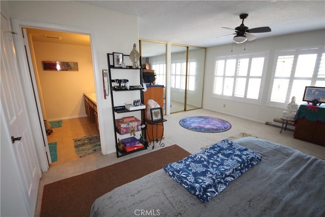 4041 Bluff Pl Unit 2, San Pedro, CA 90731 - bedroom featuring two closets, baseboards, carpet flooring, and ensuite bath