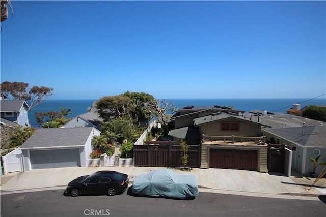 4041 Bluff Pl Unit 2, San Pedro, CA 90731 - view of front of property with a water view, fence, concrete driveway, and a garage