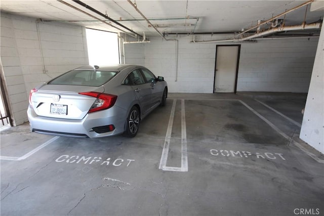 4041 Bluff Pl Unit 2, San Pedro, CA 90731 - parking garage featuring concrete block wall