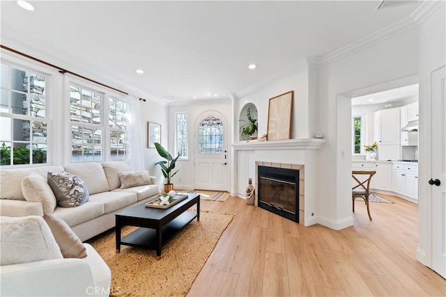 214 Sapphire Ave, Newport Beach, CA 92662 - living room with ornamental molding, light wood-style flooring, a tile fireplace, and recessed lighting