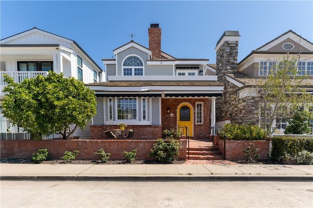 214 Sapphire Ave, Newport Beach, CA 92662 - view of front of house featuring brick siding, a fenced front yard, and a chimney