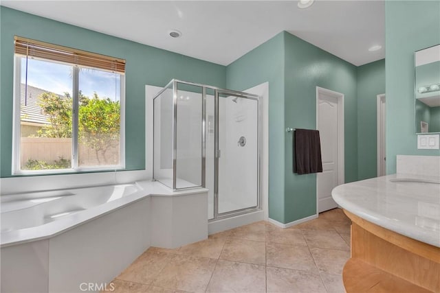 197 Potter Crk, Beaumont, CA 92223 - full bath featuring a shower stall, a garden tub, vanity, and tile patterned flooring